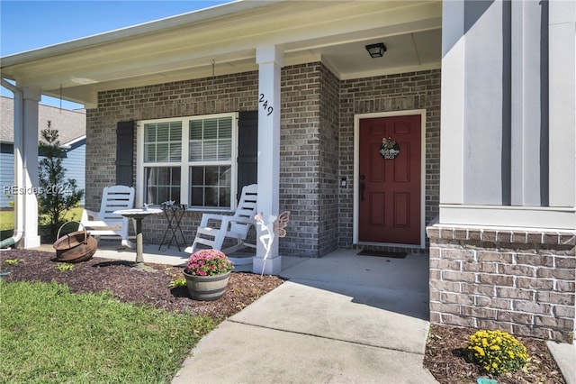 doorway to property featuring covered porch