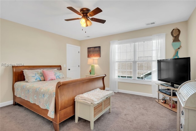 carpeted bedroom featuring ceiling fan