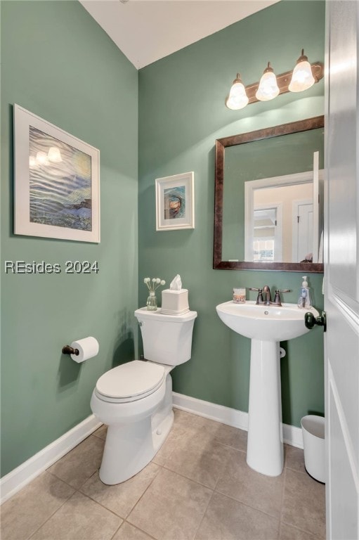 bathroom featuring tile patterned floors and toilet