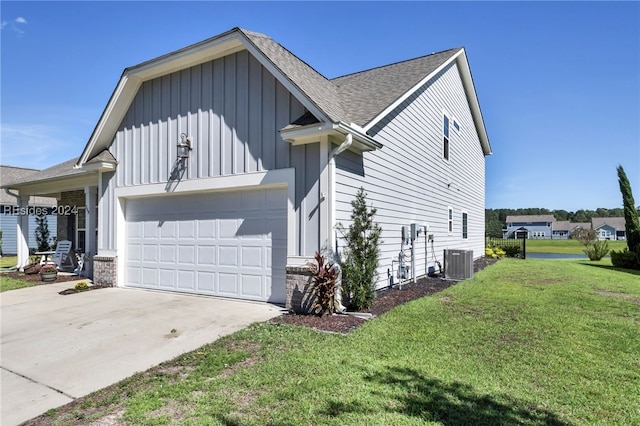 view of property exterior featuring central AC, a garage, and a lawn