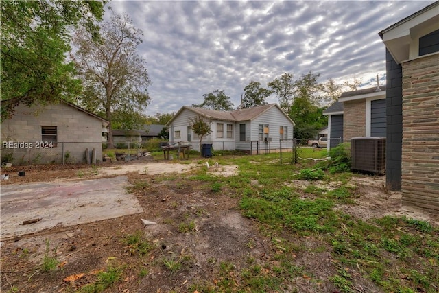 view of yard with central AC