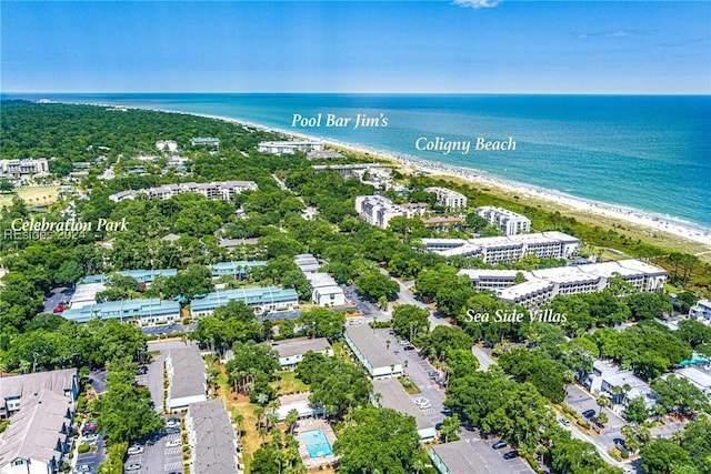 drone / aerial view with a beach view and a water view