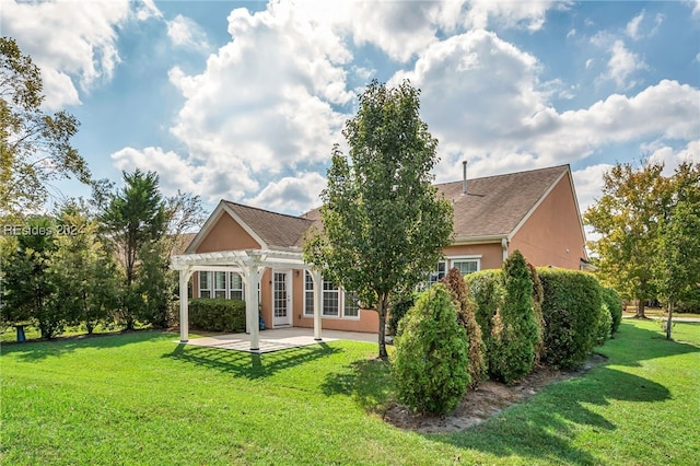 back of house with a patio, a yard, and a pergola