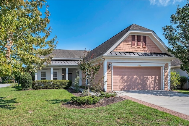 view of front of house featuring a garage and a front yard