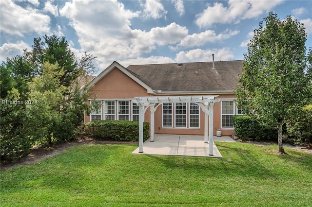 back of property featuring a yard, a pergola, and a patio area