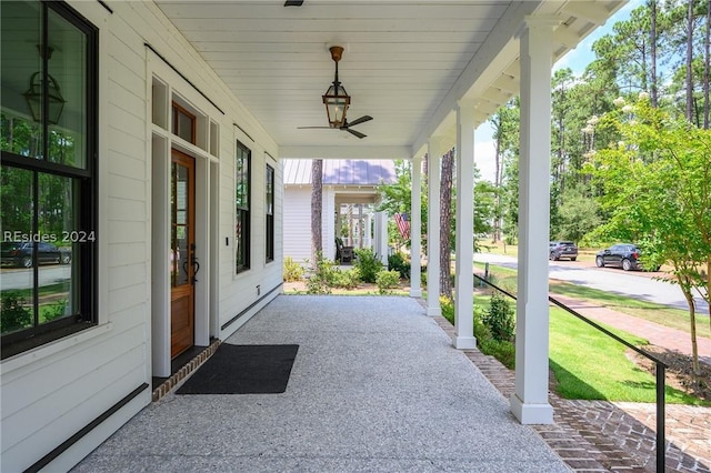 view of patio with ceiling fan and a porch