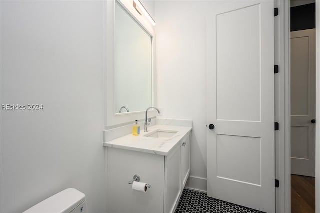 bathroom with vanity and toilet