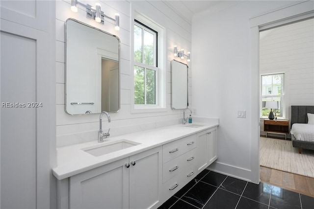 bathroom featuring tile patterned flooring and vanity