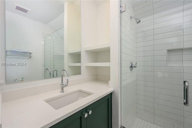 bathroom with built in shelves, vanity, and a shower with door