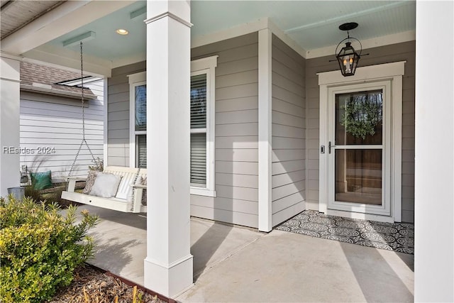 entrance to property featuring a porch