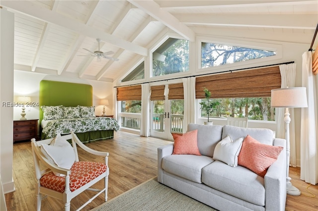 bedroom with high vaulted ceiling, access to exterior, ceiling fan, beam ceiling, and light hardwood / wood-style flooring