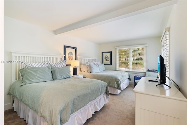 bedroom with carpet floors and beam ceiling