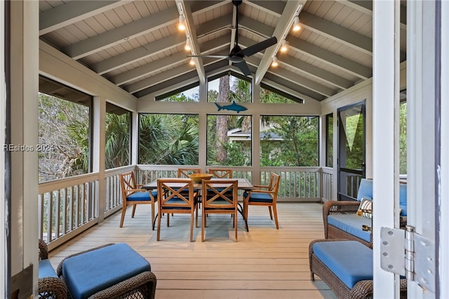 sunroom / solarium with lofted ceiling with beams and ceiling fan