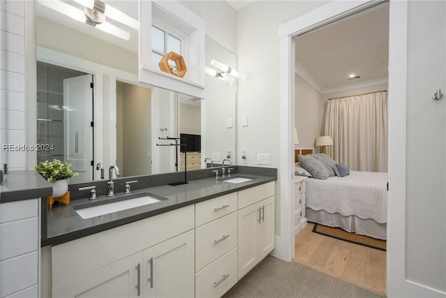 bathroom with vanity and hardwood / wood-style flooring