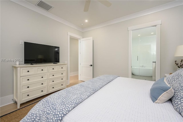 bedroom featuring ornamental molding, ceiling fan, and ensuite bathroom