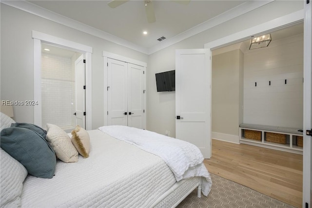 bedroom with hardwood / wood-style flooring, ceiling fan, and crown molding