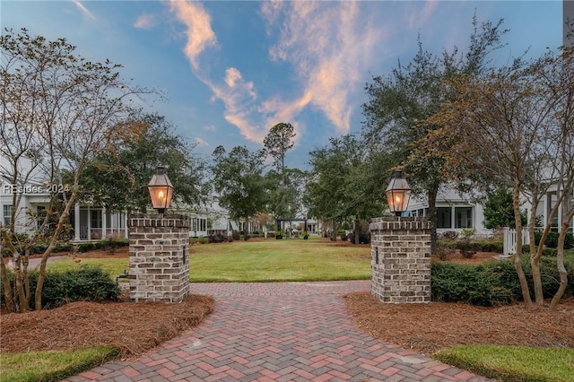 view of home's community featuring a lawn