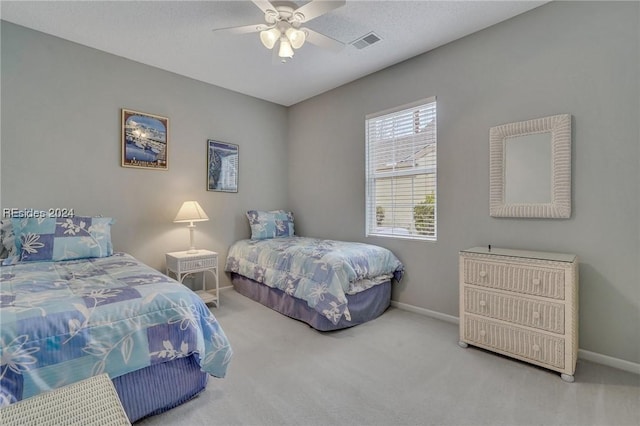 bedroom with ceiling fan and carpet flooring