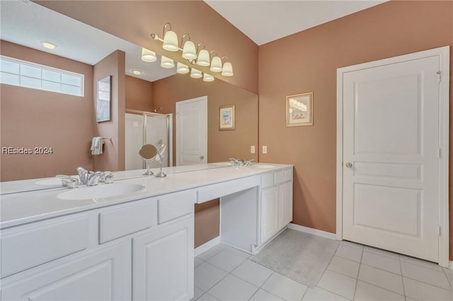 bathroom with tile patterned flooring, vanity, and a shower with shower door