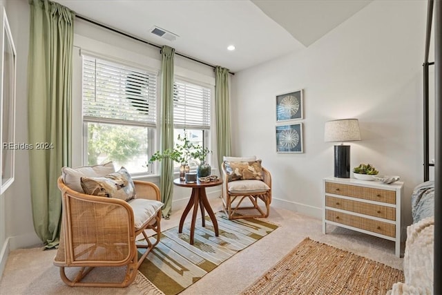 sitting room with light colored carpet