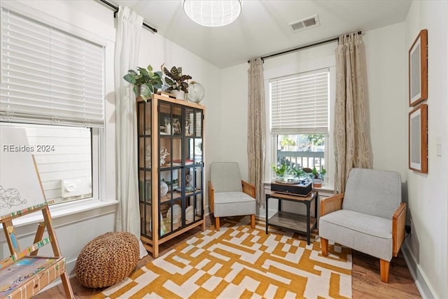 sitting room featuring light wood-type flooring