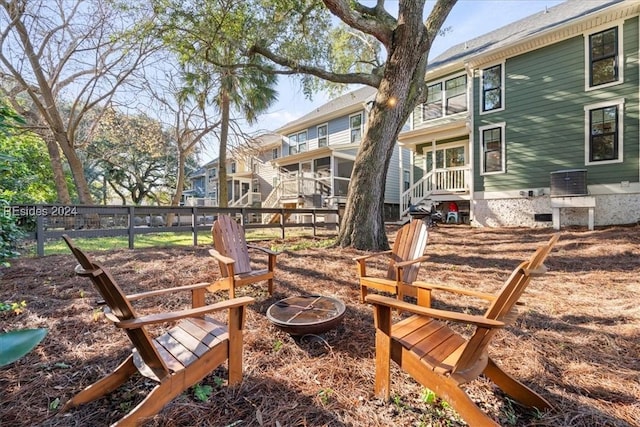 view of yard with an outdoor fire pit