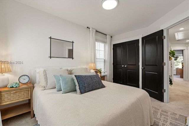 carpeted bedroom featuring multiple windows