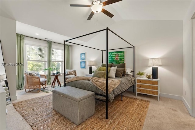 carpeted bedroom with ceiling fan and lofted ceiling