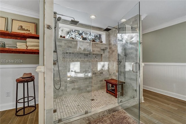 bathroom featuring an enclosed shower and crown molding