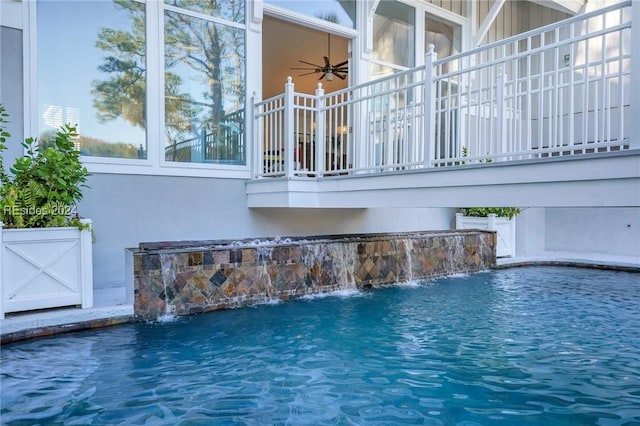 view of pool with pool water feature