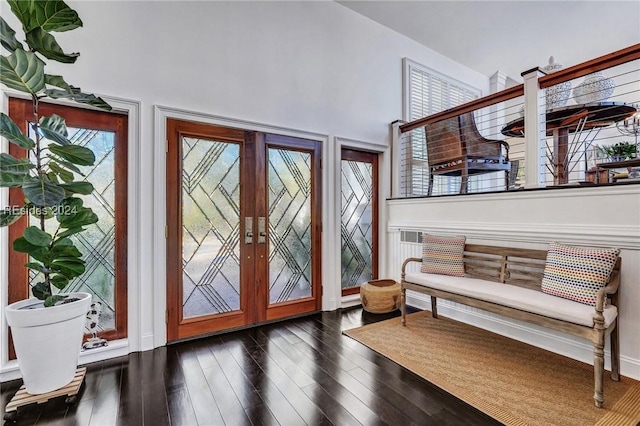 foyer entrance featuring french doors and dark hardwood / wood-style flooring