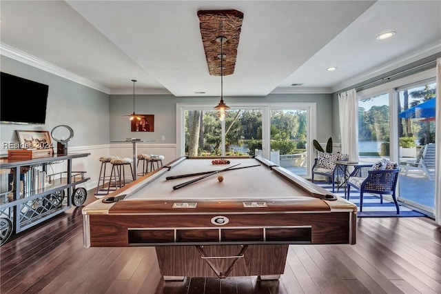 rec room with ornamental molding, a water view, dark wood-type flooring, and pool table