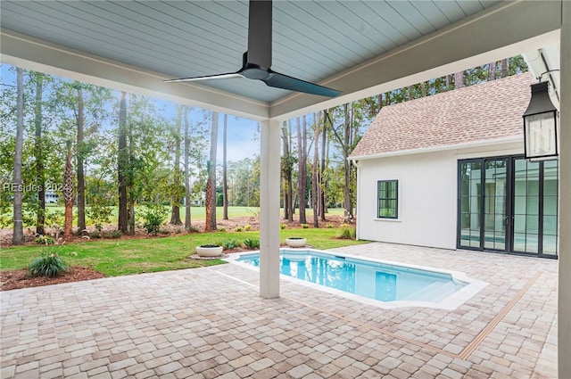 view of pool featuring a yard, a patio, and ceiling fan