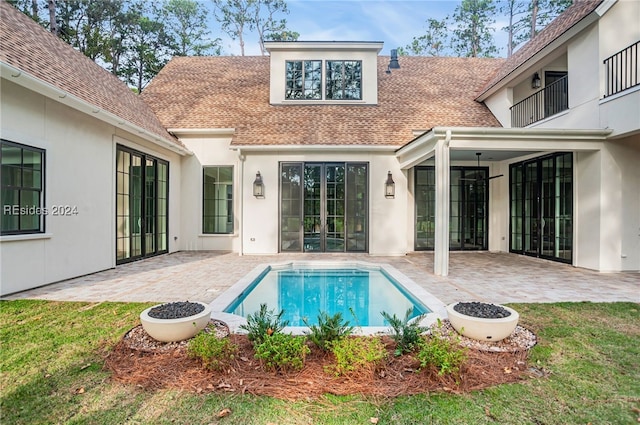 view of pool with a yard and a patio