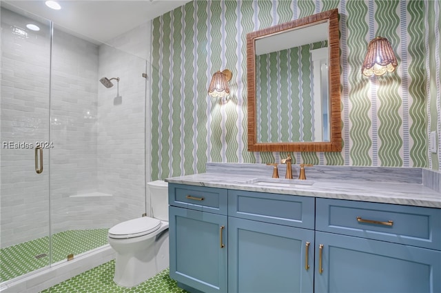 bathroom with walk in shower, vanity, toilet, and tile patterned flooring