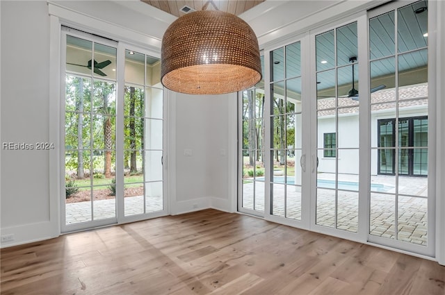 entryway with ceiling fan, plenty of natural light, and light wood-type flooring