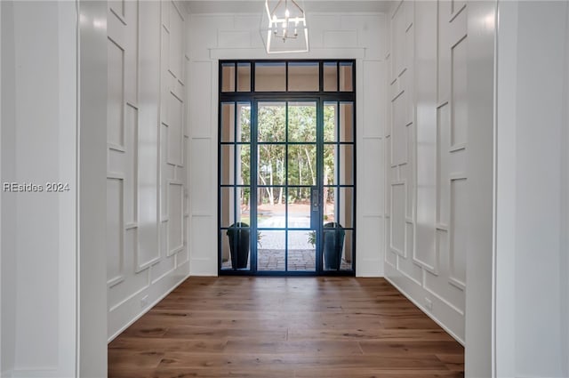 foyer featuring a notable chandelier and dark hardwood / wood-style flooring