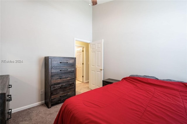 bedroom featuring light colored carpet