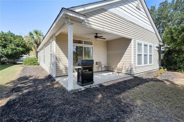 rear view of house featuring a patio area and ceiling fan