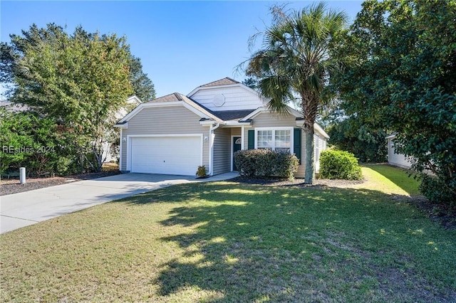 view of front of home featuring a garage and a front yard