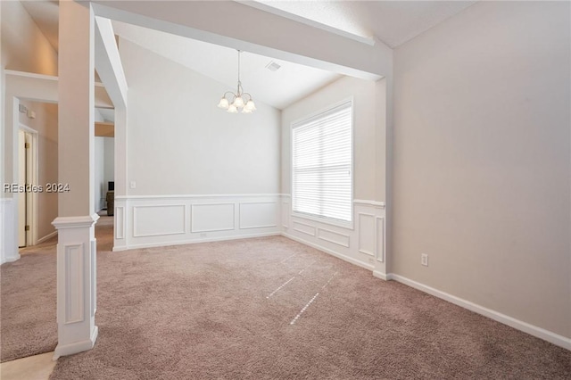 spare room with an inviting chandelier, light colored carpet, and vaulted ceiling