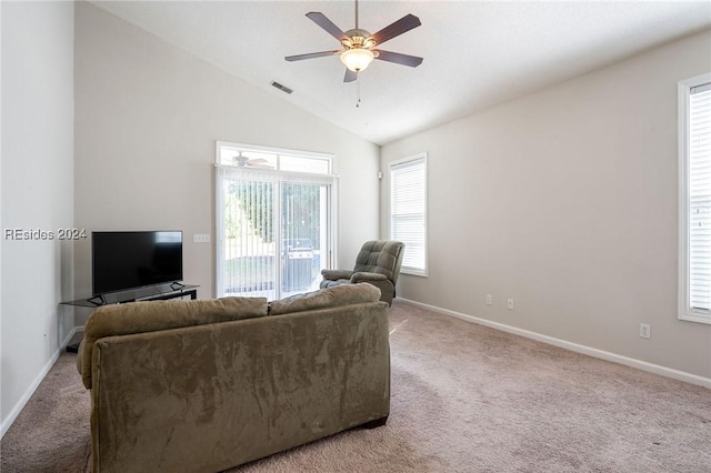 living room featuring lofted ceiling, light colored carpet, and ceiling fan