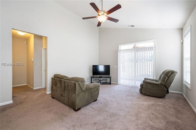 living room with ceiling fan, light carpet, and high vaulted ceiling