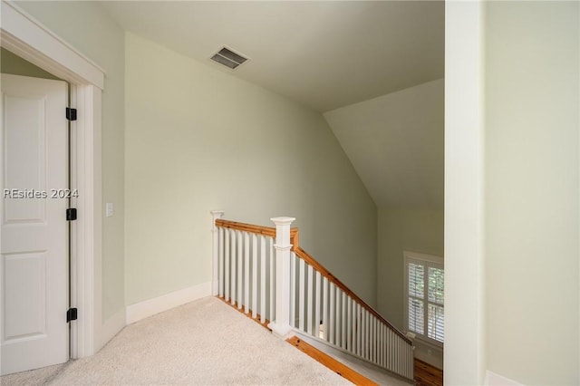 interior space with lofted ceiling and carpet