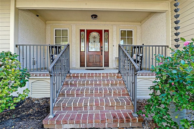 property entrance featuring a porch