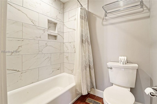 bathroom featuring hardwood / wood-style flooring, toilet, and shower / bath combo with shower curtain