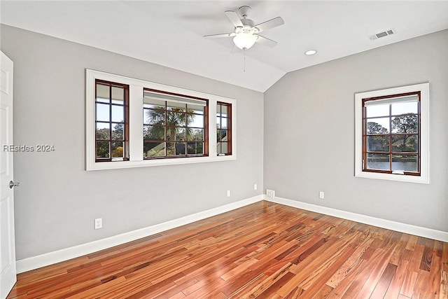 unfurnished room featuring ceiling fan, vaulted ceiling, and light hardwood / wood-style flooring