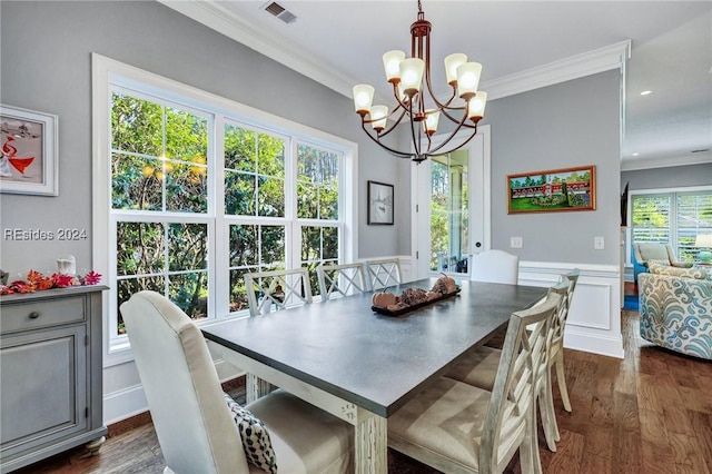 dining space with dark wood-type flooring and ornamental molding