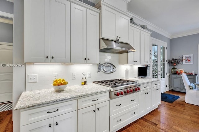 kitchen with white cabinetry, decorative backsplash, ornamental molding, stainless steel gas cooktop, and light hardwood / wood-style flooring