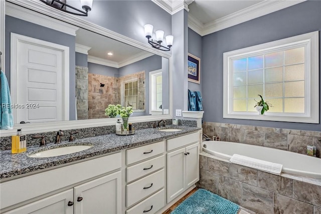 bathroom with vanity, ornamental molding, and independent shower and bath